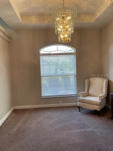a bedroom with furniture and a flat screen tv