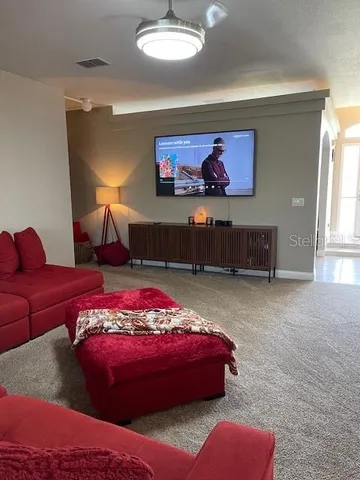 a living room with furniture and a window