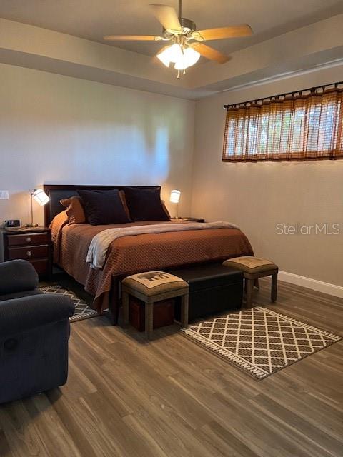 4493 Southwest 102nd Lane Road Ocala, FL 34476 - Photo 17 of 63 a bedroom with double bed and a window