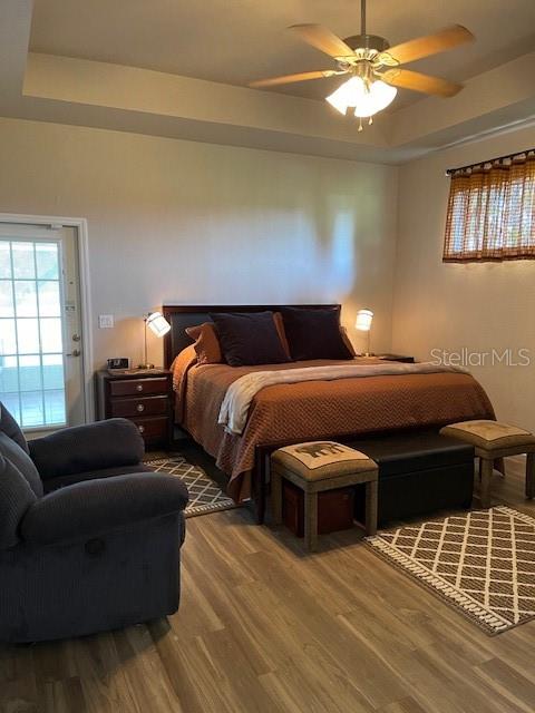 4493 Southwest 102nd Lane Road Ocala, FL 34476 - Photo 19 of 63 a bedroom with furniture and a window