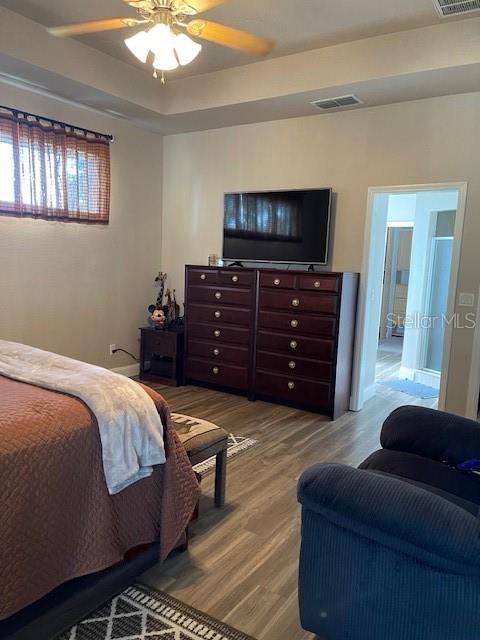 4493 Southwest 102nd Lane Road Ocala, FL 34476 - Photo 20 of 63 a bedroom with a bed and flat screen tv