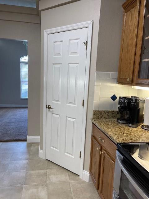 4493 Southwest 102nd Lane Road Ocala, FL 34476 - Photo 29 of 63 a kitchen with granite countertop a sink and a stove