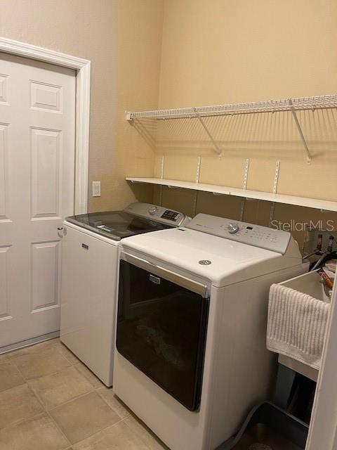 4493 Southwest 102nd Lane Road Ocala, FL 34476 - Photo 37 of 63 a utility room with dryer and washer
