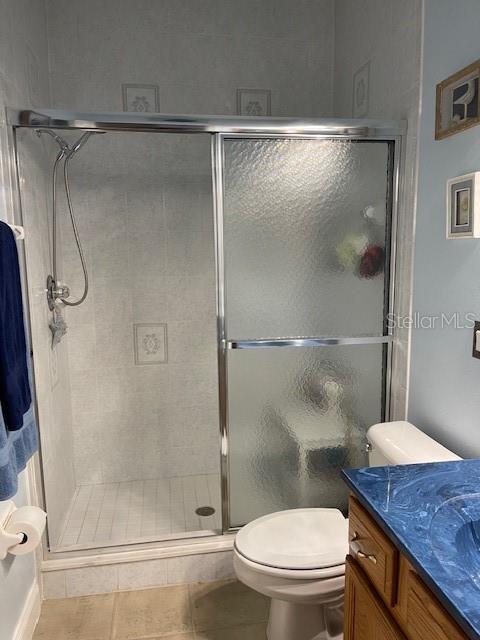 4493 Southwest 102nd Lane Road Ocala, FL 34476 - Photo 42 of 63 a bathroom with a granite countertop toilet sink and shower