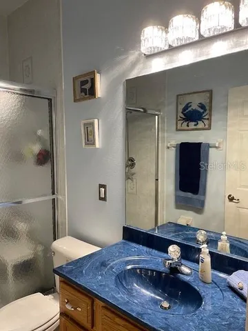 a room with a wooden floor and a large window