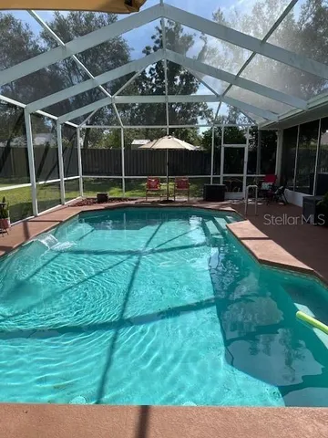 a view of a swimming pool with a patio