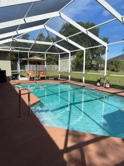 4493 Southwest 102nd Lane Road Ocala, FL 34476 - Photo 56 of 63 a view of a chairs and table in the patio