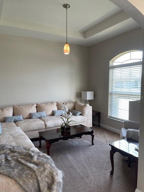 4493 Southwest 102nd Lane Road Ocala, FL 34476 - Photo 10 of 63 a living room with couches and large window with exposed radiator