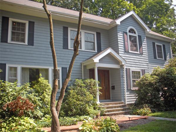 80 Washington Street Wellesley, MA 02481 - Photo 1 of 1 a front view of a house with garden