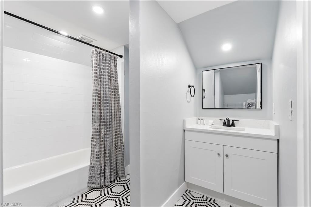 541 94th Avenue North Naples, FL 34108 - Photo 15 of 21 a bathroom with a sink a toilet and shower