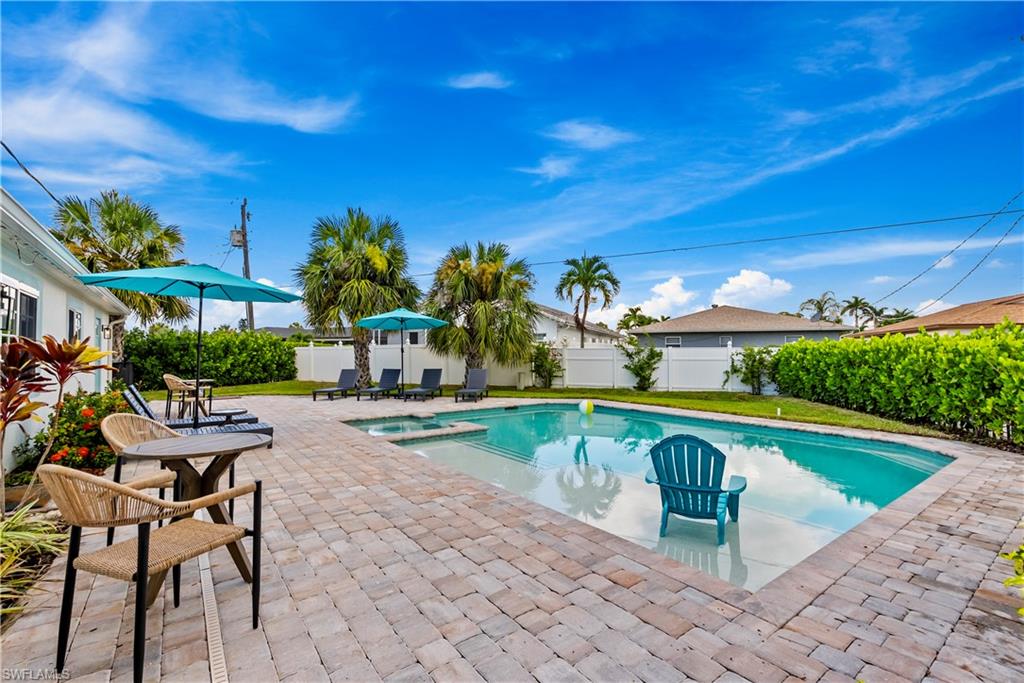 541 94th Avenue North Naples, FL 34108 - Photo 16 of 21 a swimming pool with outdoor seating