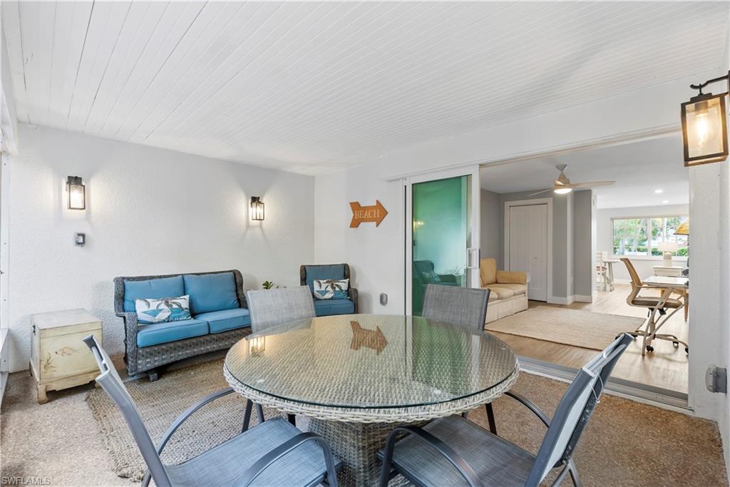 541 94th Avenue North Naples, FL 34108 - Photo 9 of 21 a living room with furniture and a table