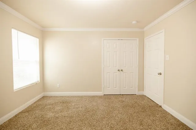 a view of an empty room and window