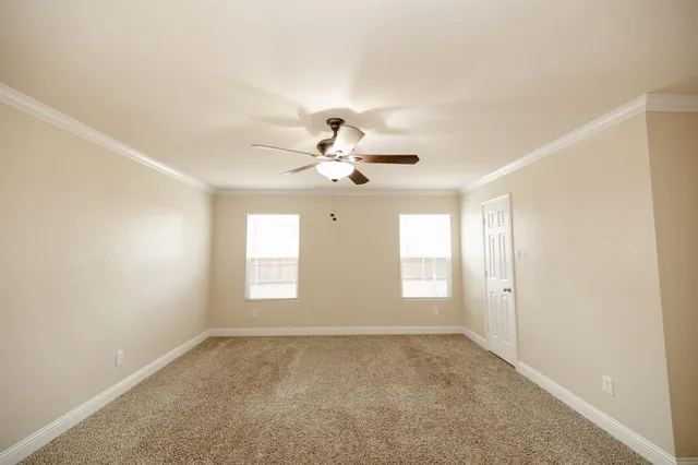 a view of empty room with windows