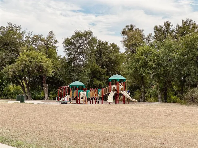 a view of a town with large trees