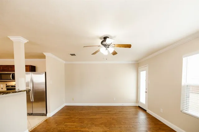 a view of a livingroom with wooden floor
