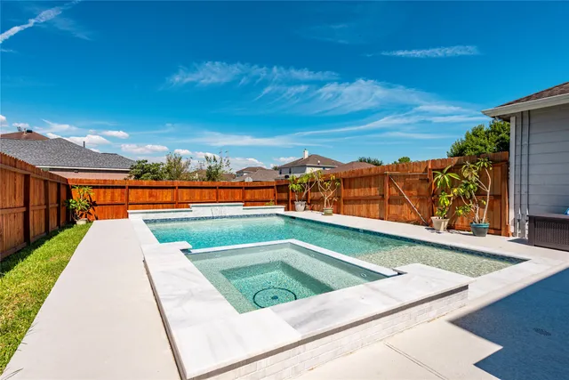 a view of swimming pool with lounge chair