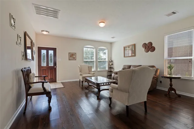a living room with furniture and a window