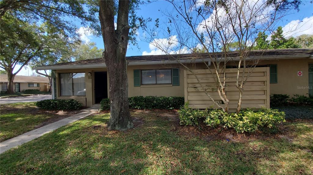 220 Cherokee Court, Unit 122 Altamonte Springs, FL 32701 - Photo 1 of 1 a front view of a house with a yard