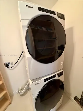 a bathroom with a glass door shower a sink and a toilet