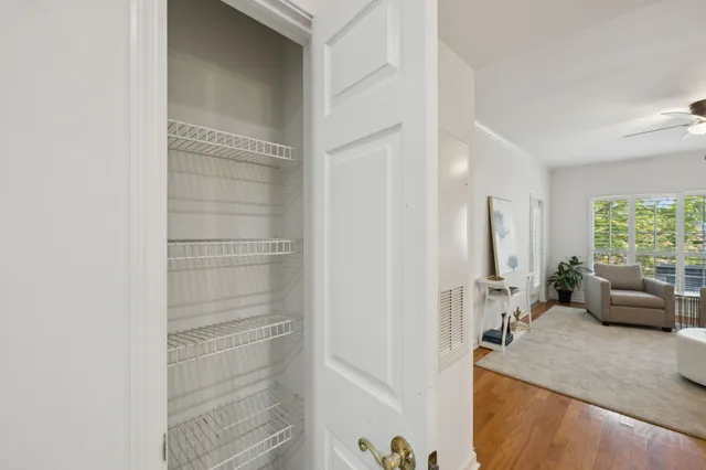 a view of a bathroom with tub shower and windows