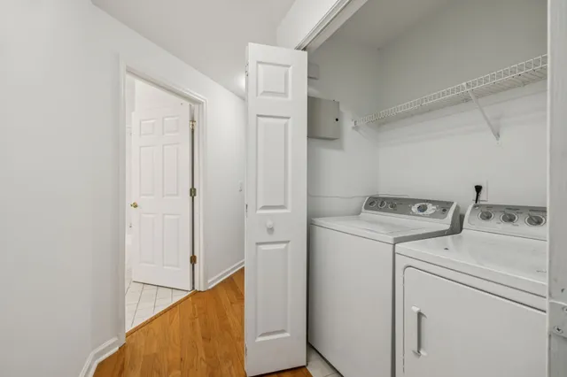 a view of storage and utility room with washer and dryer