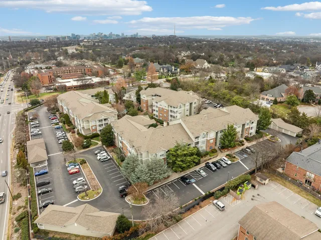 an aerial view of residential house with parking