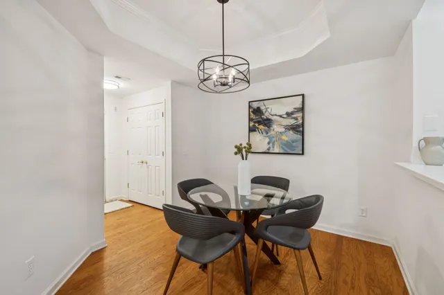 a view of a dining room with furniture and wooden floor