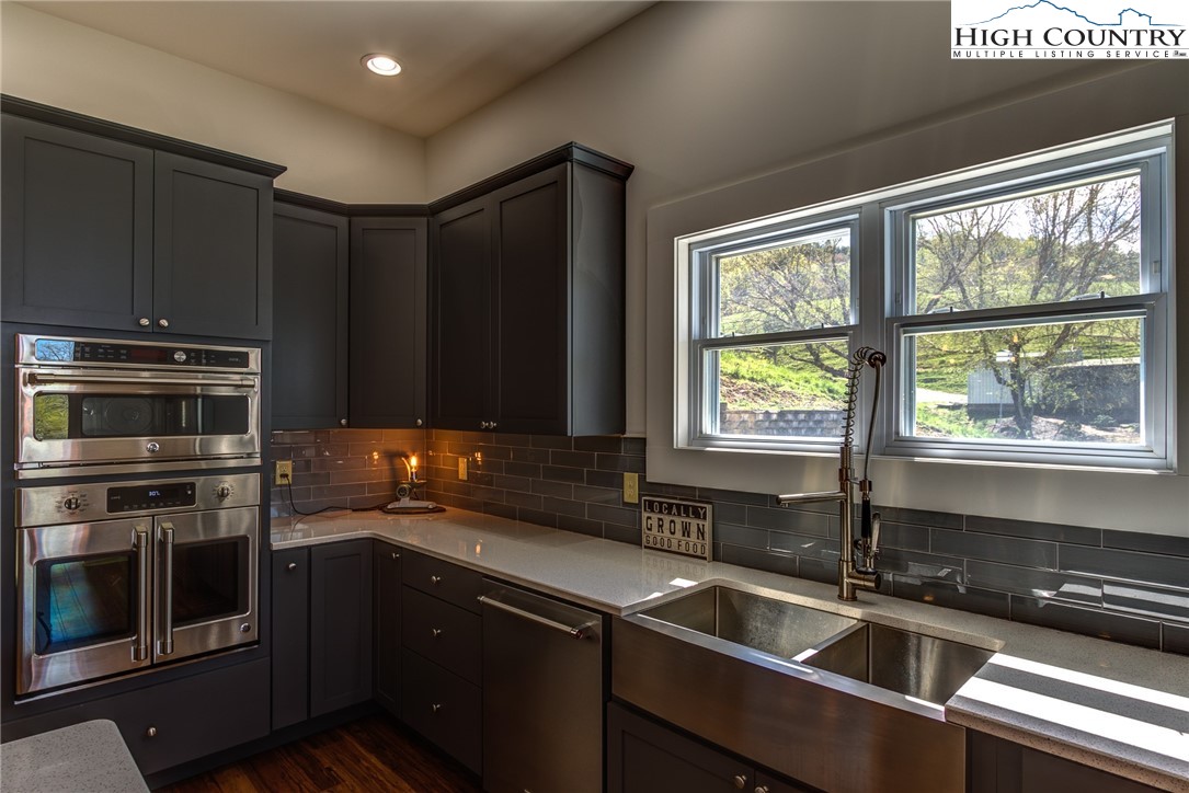 2388 Carsonville Road Independence, VA 24348 - Photo 15 of 50 a kitchen with a sink stove and microwave