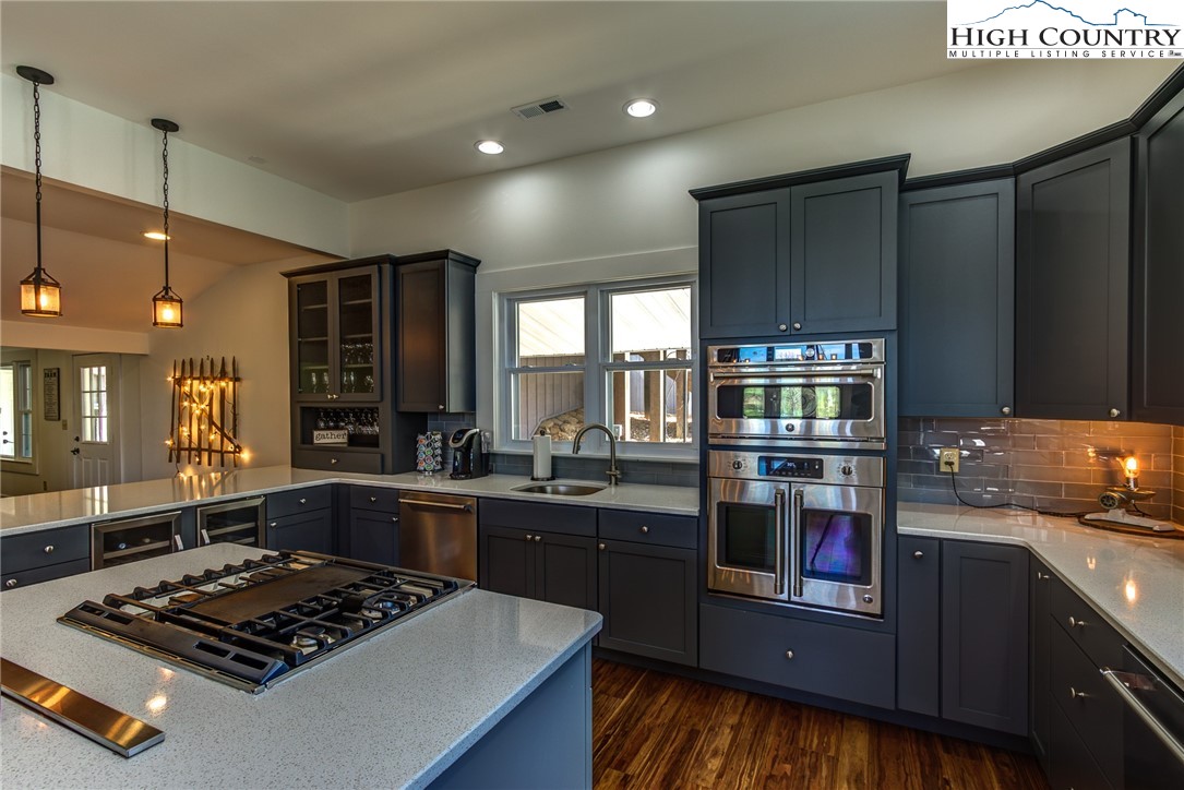 2388 Carsonville Road Independence, VA 24348 - Photo 16 of 50 a kitchen with stainless steel appliances granite countertop a stove a sink dishwasher a refrigerator and a stove