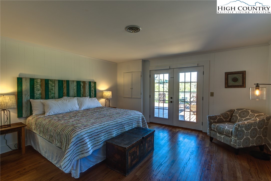 2388 Carsonville Road Independence, VA 24348 - Photo 21 of 50 a spacious bedroom with a bed and wooden floor
