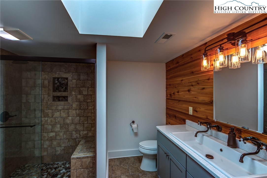 2388 Carsonville Road Independence, VA 24348 - Photo 26 of 50 a bathroom with a sink a toilet and shower