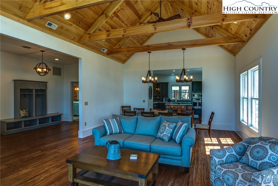 2388 Carsonville Road Independence, VA 24348 - Photo 7 of 50 a living room with furniture a dining table and a fireplace