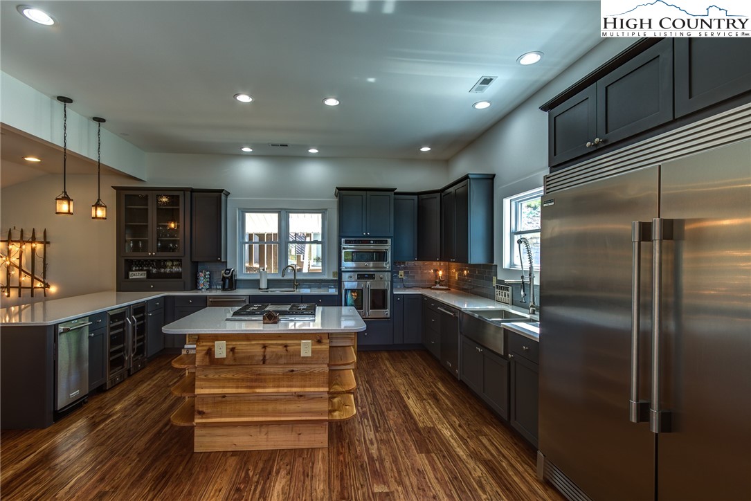 2388 Carsonville Road Independence, VA 24348 - Photo 9 of 50 a kitchen with sink refrigerator and stove