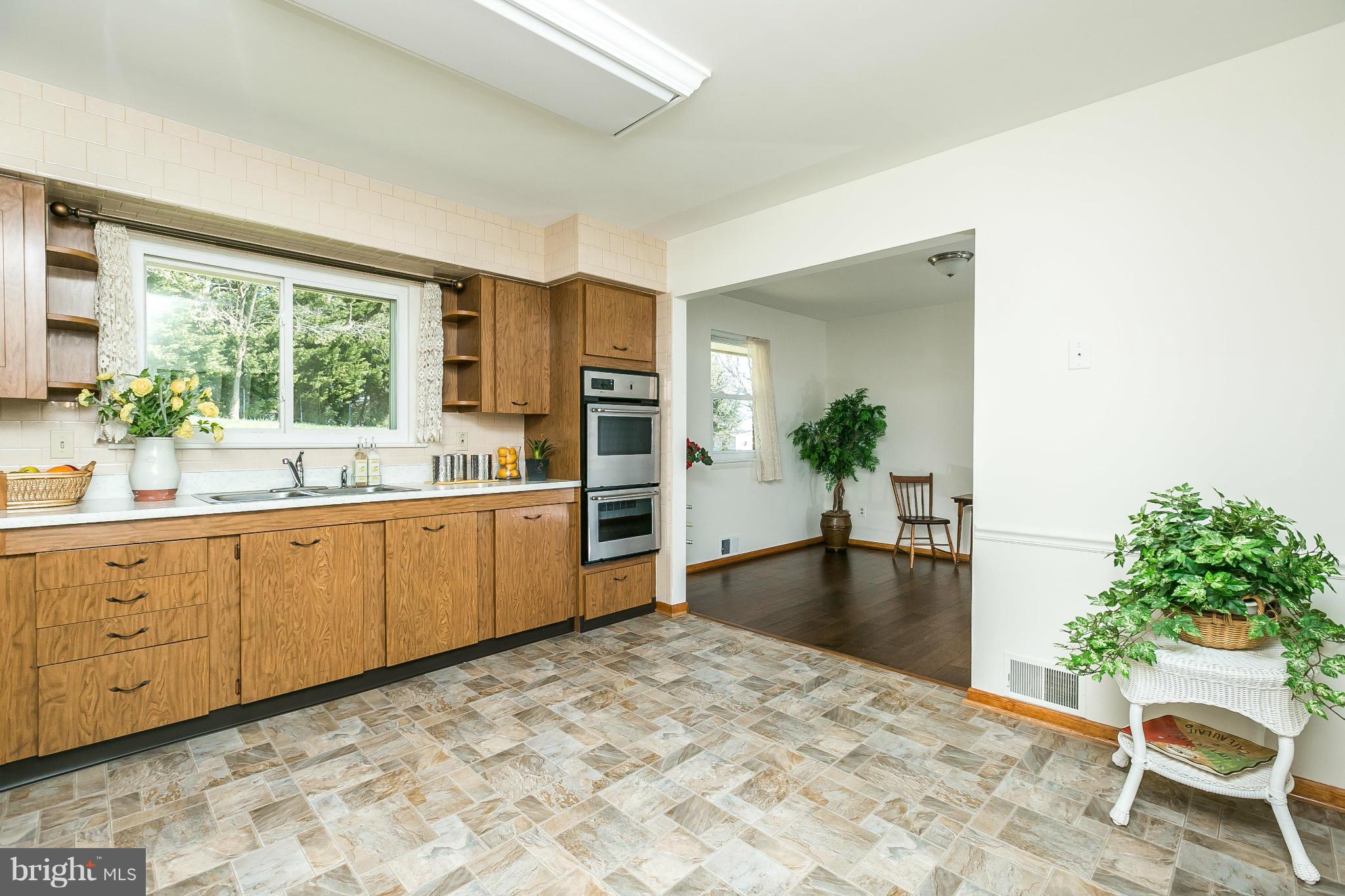 829 Hilltop Road Catonsville, MD 21228 - Photo 9 of 27 Kitchen opens to DR. Plenty of room for table.