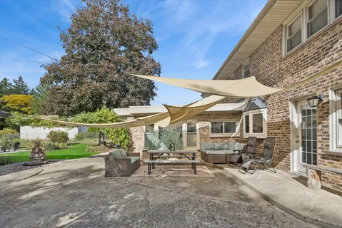a view of a table and chairs in the garden