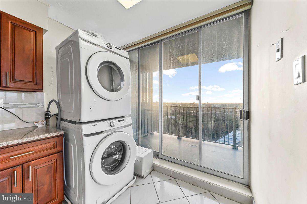 3900 West Ford Road, Unit 17P Philadelphia, PA 19131 - Photo 13 of 28 a view of a hallway with washer and dryer