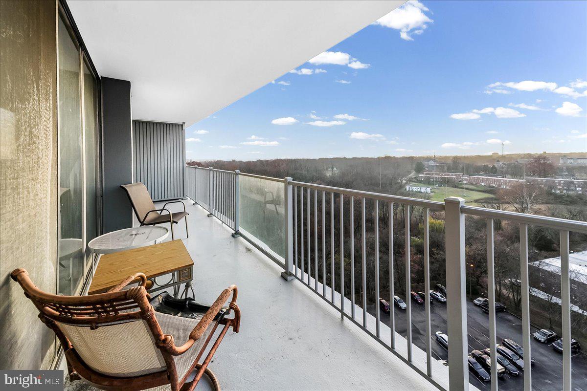 3900 West Ford Road, Unit 17P Philadelphia, PA 19131 - Photo 14 of 28 a balcony with table and chairs