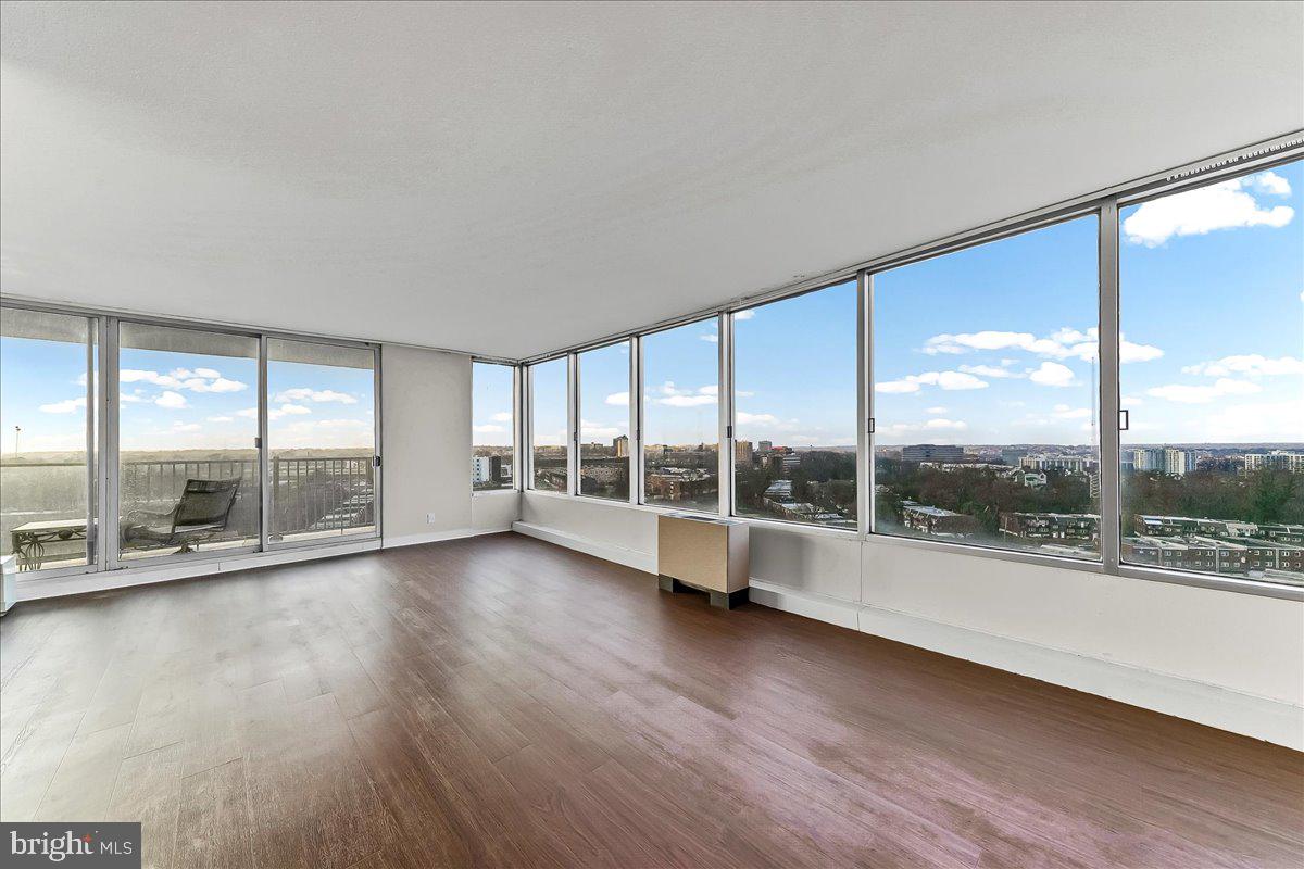 3900 West Ford Road, Unit 17P Philadelphia, PA 19131 - Photo 3 of 28 a view of room with window and wooden floor