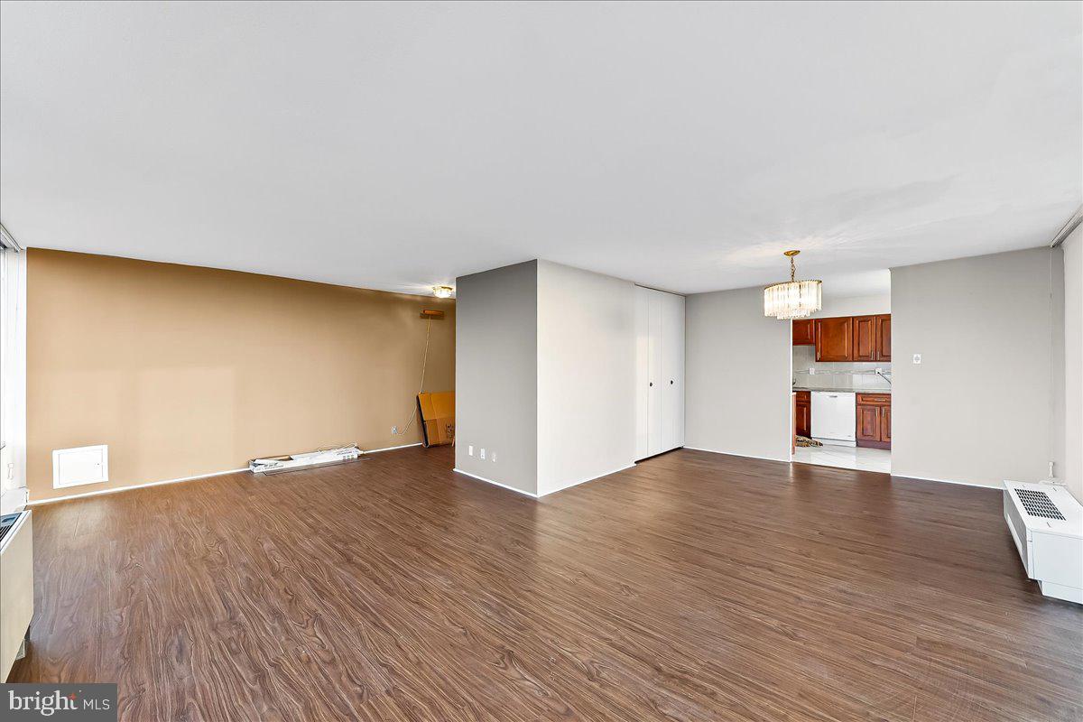 3900 West Ford Road, Unit 17P Philadelphia, PA 19131 - Photo 6 of 28 a view of empty room with wooden floor