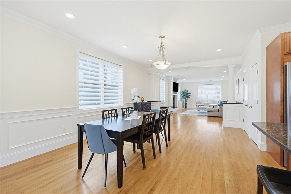 98-100 Lexington Street, Unit 100 Newton, MA 02466 - Photo 14 of 42 a view of a dining room with furniture and wooden floor