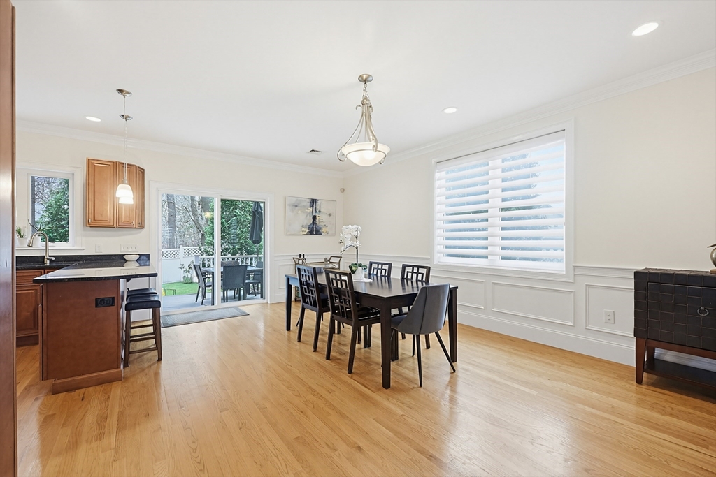 98-100 Lexington Street, Unit 100 Newton, MA 02466 - Photo 15 of 42 a view of a dining room with furniture and chandelier