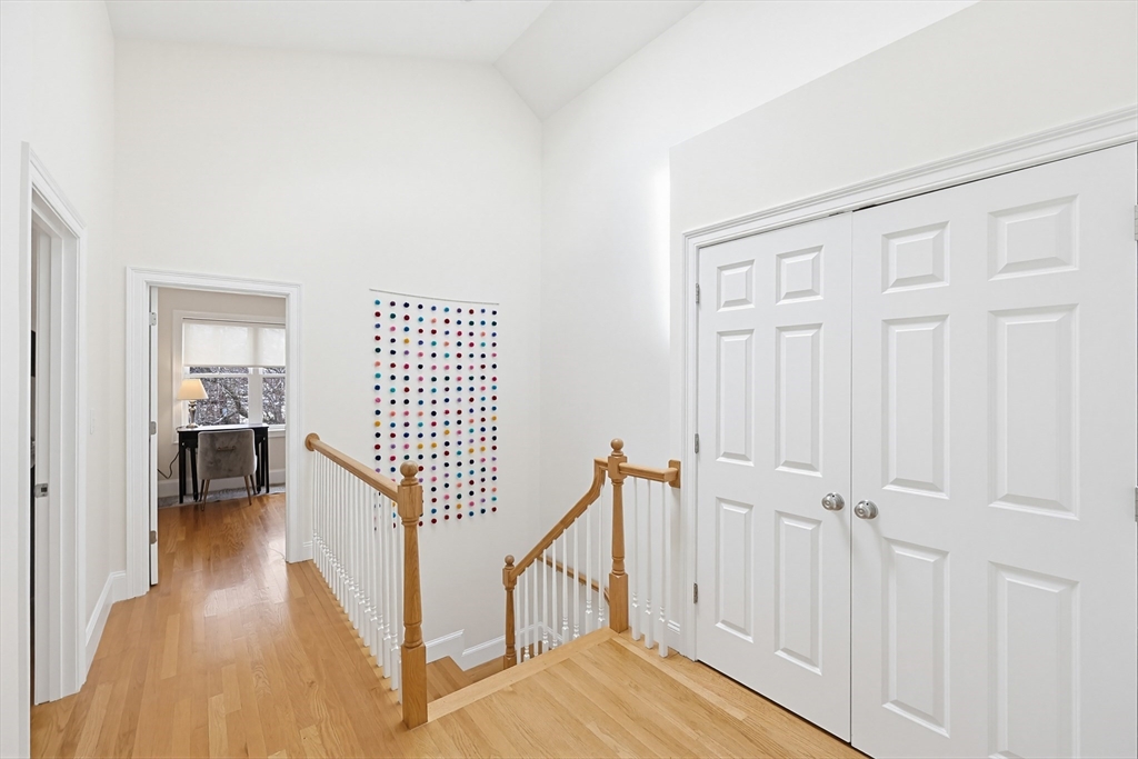 98-100 Lexington Street, Unit 100 Newton, MA 02466 - Photo 18 of 42 a view of a hallway with wooden floor and entryway