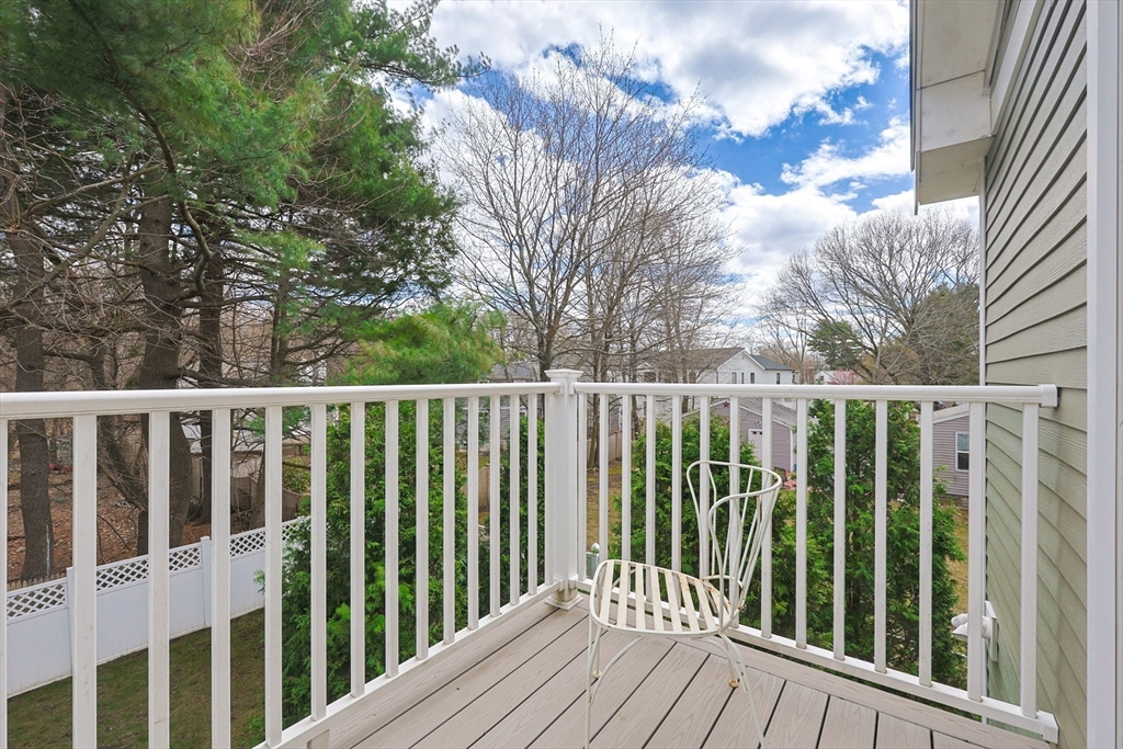 98-100 Lexington Street, Unit 100 Newton, MA 02466 - Photo 35 of 42 a view of a wooden fence