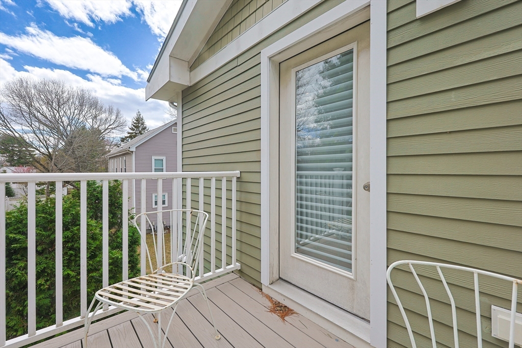 98-100 Lexington Street, Unit 100 Newton, MA 02466 - Photo 36 of 42 a view of a balcony with wooden floor