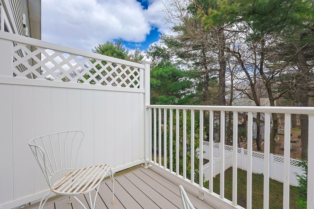 98-100 Lexington Street, Unit 100 Newton, MA 02466 - Photo 37 of 42 a view of wooden balcony with furniture
