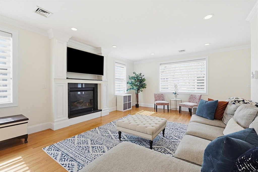 98-100 Lexington Street, Unit 100 Newton, MA 02466 - Photo 6 of 42 a living room with furniture and a flat screen tv