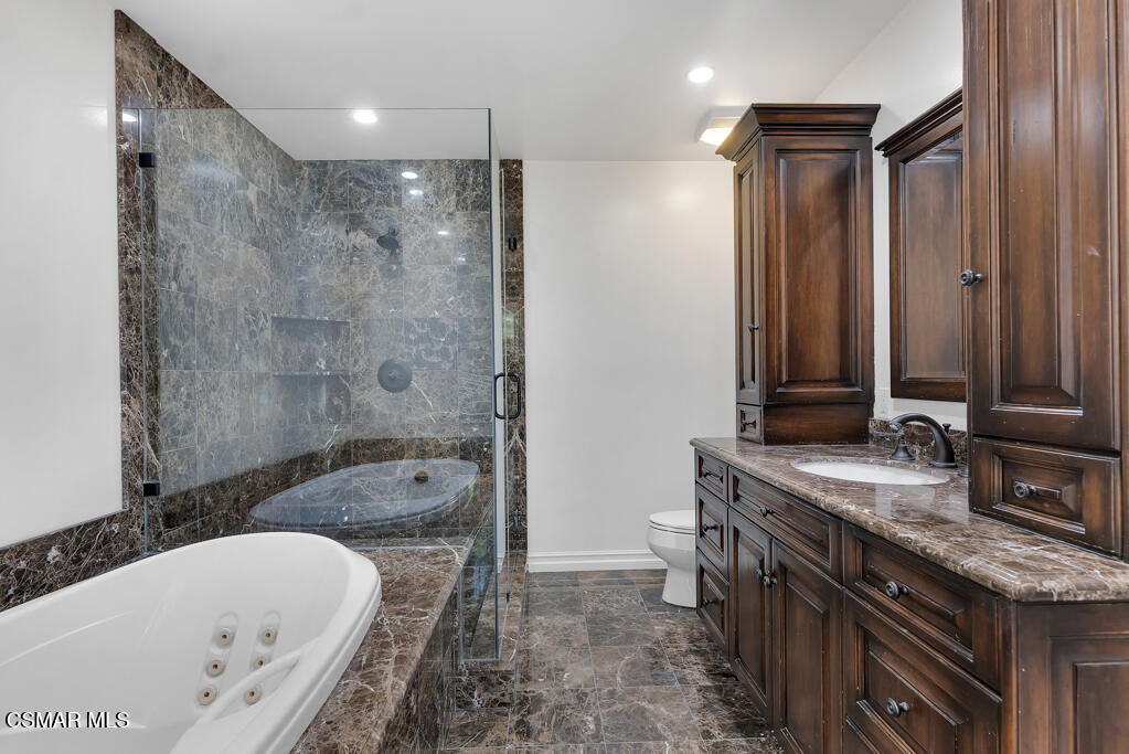 1153 Camino Dos Rios Thousand Oaks, CA 91360 - Photo 37 of 71 a bathroom with a granite countertop tub sink and mirror