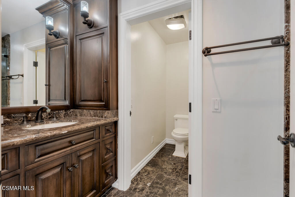 1153 Camino Dos Rios Thousand Oaks, CA 91360 - Photo 44 of 71 a bathroom with a sink and a mirror