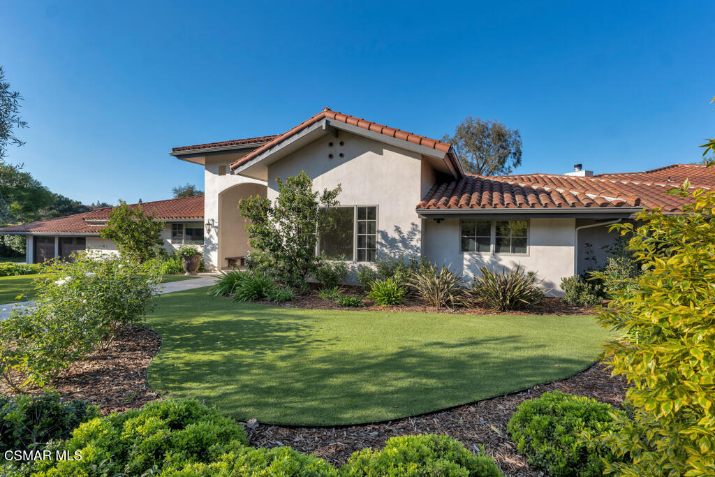 1153 Camino Dos Rios Thousand Oaks, CA 91360 - Photo 51 of 71 a front view of a house with a yard